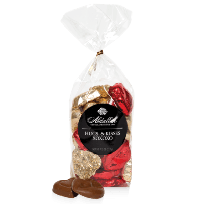 Hugs and Kisses foil heart shaped milk chocolates in clear bag